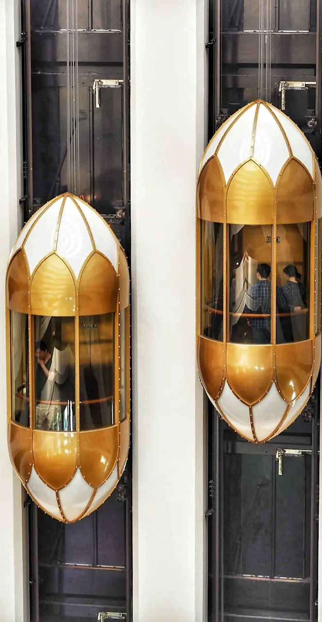 two gold capsule elevator